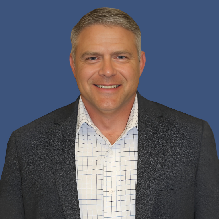 Headshot-Mark-McCormick-Blue-Background-1